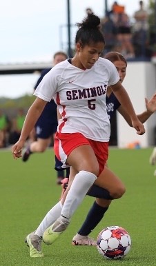 Sophomore Captain Aaliyaiah Durden Takes On a Defender in Conference Play This Week.